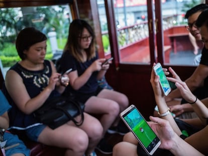 HONG KONG - JULY 30:  People join the Hong Kong&#039;s first Pokemon Go tram party on July 30, 2016 in Hong Kong, Hong Kong. Hundreds of youths attended the 18th Ani-Com and Games Hong Kong fair dressed as Japanese comic characters as the reality smartphone game Pokemon GO was launched in Hong Kong this week following the release of the app in Japan. Based on reports, shopping malls and local businesses in Hong Kong are offering Pokemon-related activities to draw in crowds that have flooded the streets to capture Pokemon while authorities aim to ban the game at public hospitals and schools after receiving complaints from the public.  (Photo by Lam Yik Fei/Getty Images)