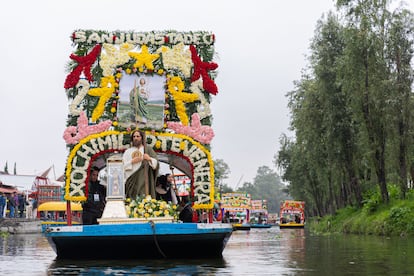 The relics of Saint Jude Thaddeus are transported in a glass urn on a trajinera through the canals of Xochimilco, on Sunday, August 11, 2024.