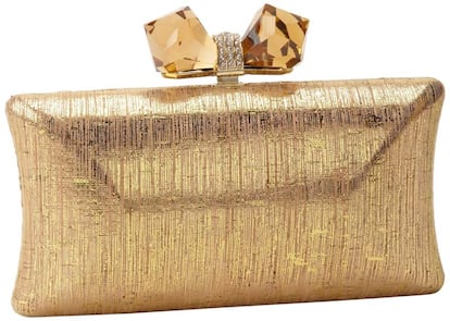 Clutch glitter con cierre en forma de lazo de Judith Leiber (304 euros).