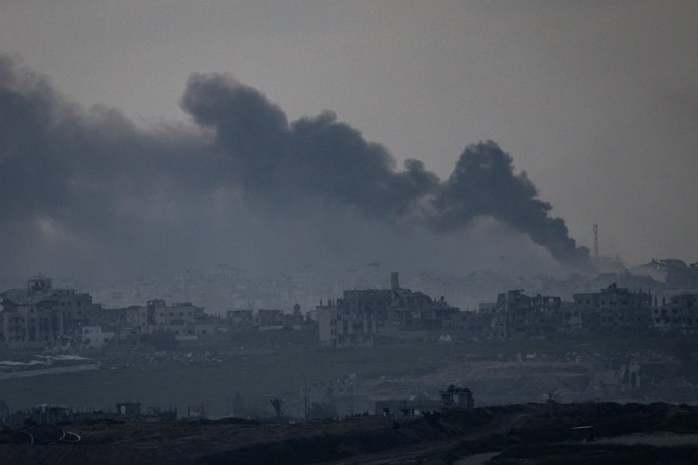 SOUTHERN ISRAEL - JANUARY 17: Smoke rises over the Gaza Strip after an Israeli strike,  as seen from a position on the Israeli side of the border on January 17, 2025 in Southern Israel, Israel. On Wednesday, a ceasefire deal between Israel and Hamas was announced by mediators in the conflict. Formal approval from Israel's cabinet was expected on Thursday but delayed until Friday, although mediators insisted the deal was still expected to take effect on Sunday. (Photo by Chris McGrath/Getty Images)