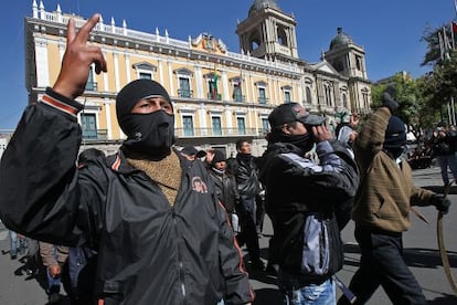 Police march through Bolivia after confronting indigenous peoples faithful to President Evo Morales.