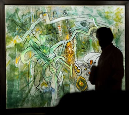 A visitor contemplates 'Miroir de la mémoire', by Roberto Matta.