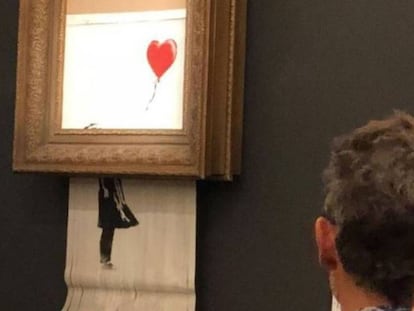 O momento em que a tela de Banksy é triturada.