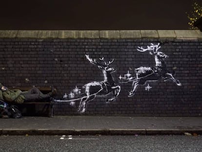 El mural navideño realizado por Banksy en Birmingham, Reino Unido.