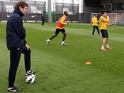 Tito y Abidal, durante el entrenamiento de este viernes.