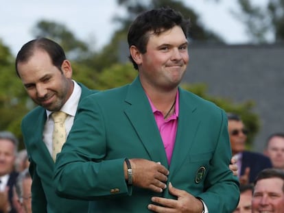 Reed, con la chaqueta verde junto a Sergio García.