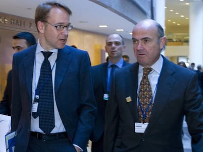 Jens Weidmann (izquierda) junto a Luis de Guindos, en una reunión del G-20 en Washington.