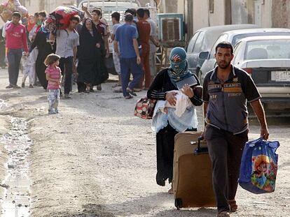 Muchos habitantes suníes tratan de salir de la zona de combate en Ramadi.