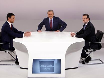 Sánchez y Rajoy, con Campo Vidal durante el debate