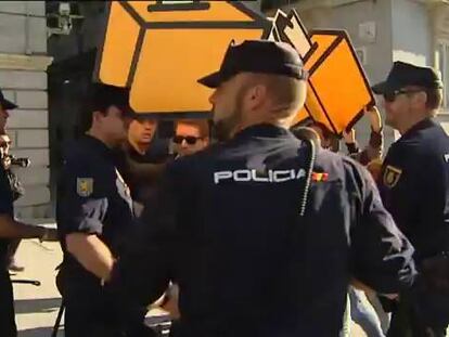 A group of protestors is removed from Congress on Tuesday.