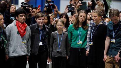 Greta Thunberg and other youths at the Madrid climate change summit on Friday.