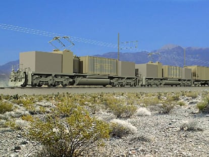 Un tren que almacena electricidad circulando cargado de rocas y cemento.