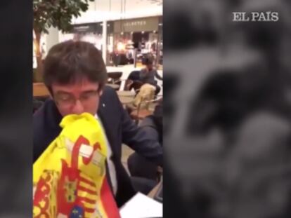 Puigdemont besa una bandera española: “No tengo ningún problema”