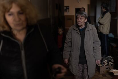 Several people take refuge on the first floor of a building in Severodonetsk.