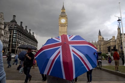 A pedestrian with a Union Flag umbrella passes by Big Ben in this file photo from June.