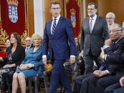 Alberto Núñez Feijóo y Mariano Rajoy, a su llegada a la toma de posesión en el que ha prometido su cargo como presidente de la Xunta de Galicia.
