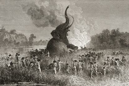 Hombres prehistóricos cazan un mamut en una ilustración de 1896.
