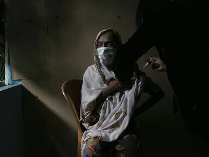 COX'S BAZAR, BANGLADESH - AUGUST 12: A Rohingya refugee is vaccinated in a Rohingya refugee camp on August 12, 2021 in Cox's Bazar, Bangladesh. On Tuesday, Bangladesh started a COVID-19 vaccination drive for Rohingya refugees. Nearly 48,000 Rohingya refugees will be inoculated with the help of the UN agencies. (Photo by Allison Joyce/Getty Images)