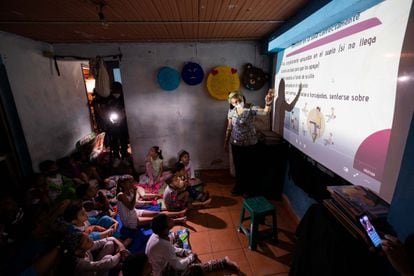 A group of children attend a class at the family home of teacher Milagros Agreda in Caracas, Venezuela, this month.