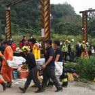 Rescue teams move the body of one of the victims of a train derailment in Taiwan.