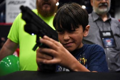 A minor practicing with virtual targets during the National Rifle Association's annual convention on Saturday, May 28, in Houston. 