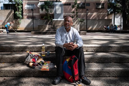 Jorge Guerra, shows products that he receives through CLAP, the program for the sale of food at subsidized prices of the Government of Venezuela.