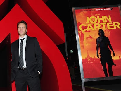 Actor Taylor Kitsch posing for the media at the premiere of 'John Carter'