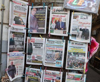 Portadas de diarios informan de la elección de Abdelmajid Tebún como presidente, este sábado en Argel.