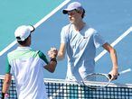 Apr 2, 2021; Miami, Florida, USA; Jannik Sinner of Italy (R) shakes hands with Roberto Bautista Agut of Spain (L) after their match in a men's singles semifinal in the Miami Open at Hard Rock Stadium. Mandatory Credit: Geoff Burke-USA TODAY Sports