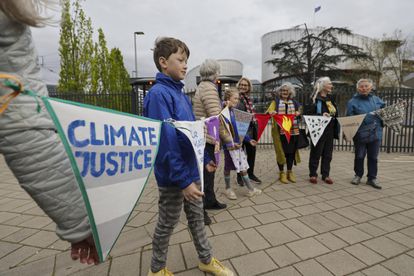Climate activists await the resolution of the European Court of Human Rights, in Strasbourg.