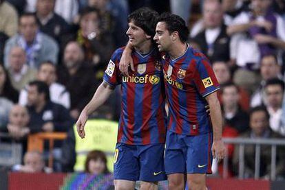 Messi y Xavi, en un momento del partido del sábado entre el Madrid y el Barcelona.
