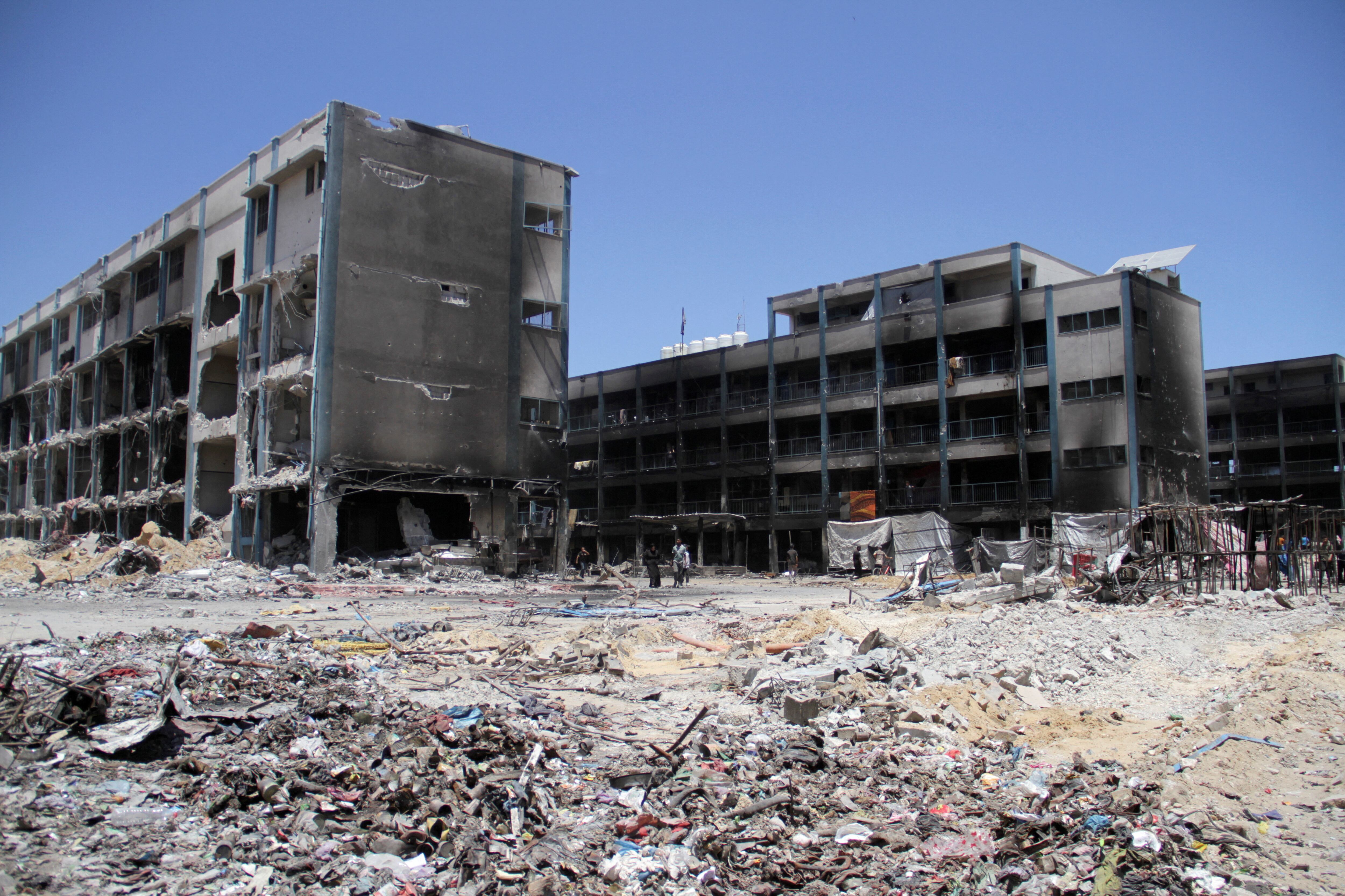 Palestinians inspect the damage at an UNRWA affiliated school, after Israeli forces withdrew from Jabalia refugee camp, following a raid, in the northern Gaza Strip, May 31, 2024. REUTERS/Mahmoud Issa     TPX IMAGES OF THE DAY