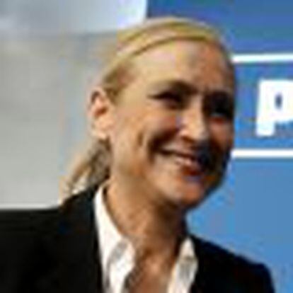 Cifuentes, Madrid's regional candidate of ruling People's Party (PP), smiles inside PP headquarters after the regional and municipal elections in Madrid