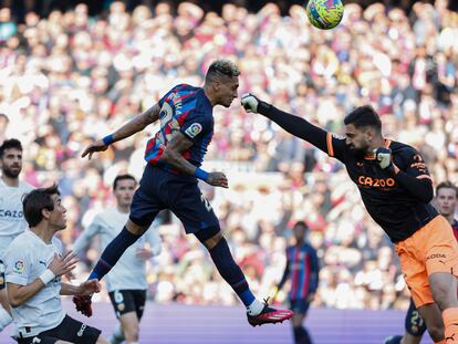 Barcelona's Raphinha scores his side's opening goal during Spanish La Liga soccer match between Barcelona and Valencia at the Camp Nou stadium in Barcelona, Spain, Sunday, March 5, 2023. (AP Photo/Joan Monfort)