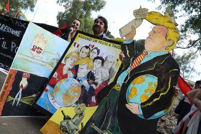 Manifestantes anti Trump ante la cumbre del G7.