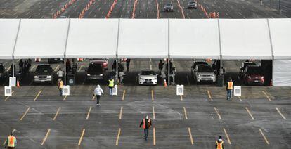Cars make their way through lines of cones as they arrive for a UCHealth drive-up mass COVID-19 vaccination event in the parking lots of Coors Field on Sunday, Jan. 24, 2021, in Denver, Colo. (Helen H. Richardson/The Denver Post via AP)