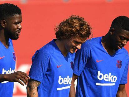 Umtiti, Griezmann y Dembélé, en la última sesión del Barça.