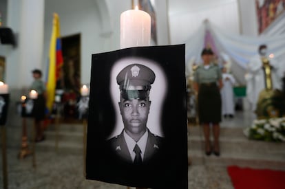A portrait of a slain police officer was displayed during a ceremony in his honor in Cali last July.