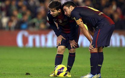 Xavi i Messi, en un Betis-Barça, el 2012.