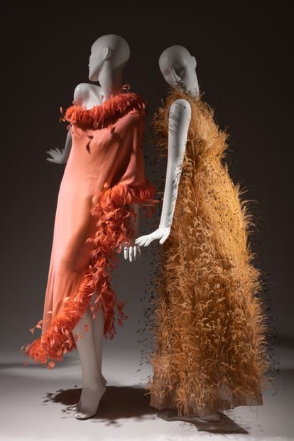 Cristóbal Balenciaga 1967 orange organza gown with ostrich feathers, left;  and Hubert de Givenchy silk dress from 1968.
