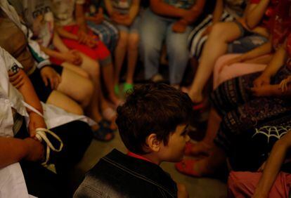 Tanya, 12, who is autistic and does not speak, sits with other children in a basement shelter after an air raid warning went off, at a facility for people with special needs, amid Russia's invasion of Ukraine, in Odesa, Ukraine, June 6, 2022. Tanya, like nine in 10 of the children in Ukraine's orphanage system, is a "social orphan" – children whose parents are unable to care for them or denied parental rights under Ukrainian law.         REUTERS/Edgar Su    SEARCH "UKRAINE DZHURIV ORPHANAGE" FOR THIS STORY. SEARCH "WIDER IMAGE" FOR ALL STORIES.
