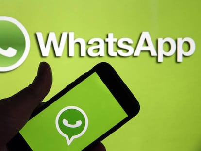 PARIS, FRANCE - MARCH 15: In this photo illustration, the social media application logo, WhatsApp is displayed on the screen of an iPhone in front of a computer screen showing a WhatsApp logo on March 15, 2019 in Paris, France. Social media Facebook, Instagram, Messenger and WhatsApp have been affected by a global outage for nearly 24 hours on March 14, 2019 cutting virtual worlds to nearly 2.3 billion potential users. Facebook has explained the causes of malfunctions that have disrupted its networks in recent days. This failure is due to the &quot;server configuration change&quot; that has caused cascading problems Facebook is excused for the inconvenience caused to users and companies that are dependent on Facebook, Instagram or WhatsApp to run their business.(Photo by Chesnot/Getty Images)