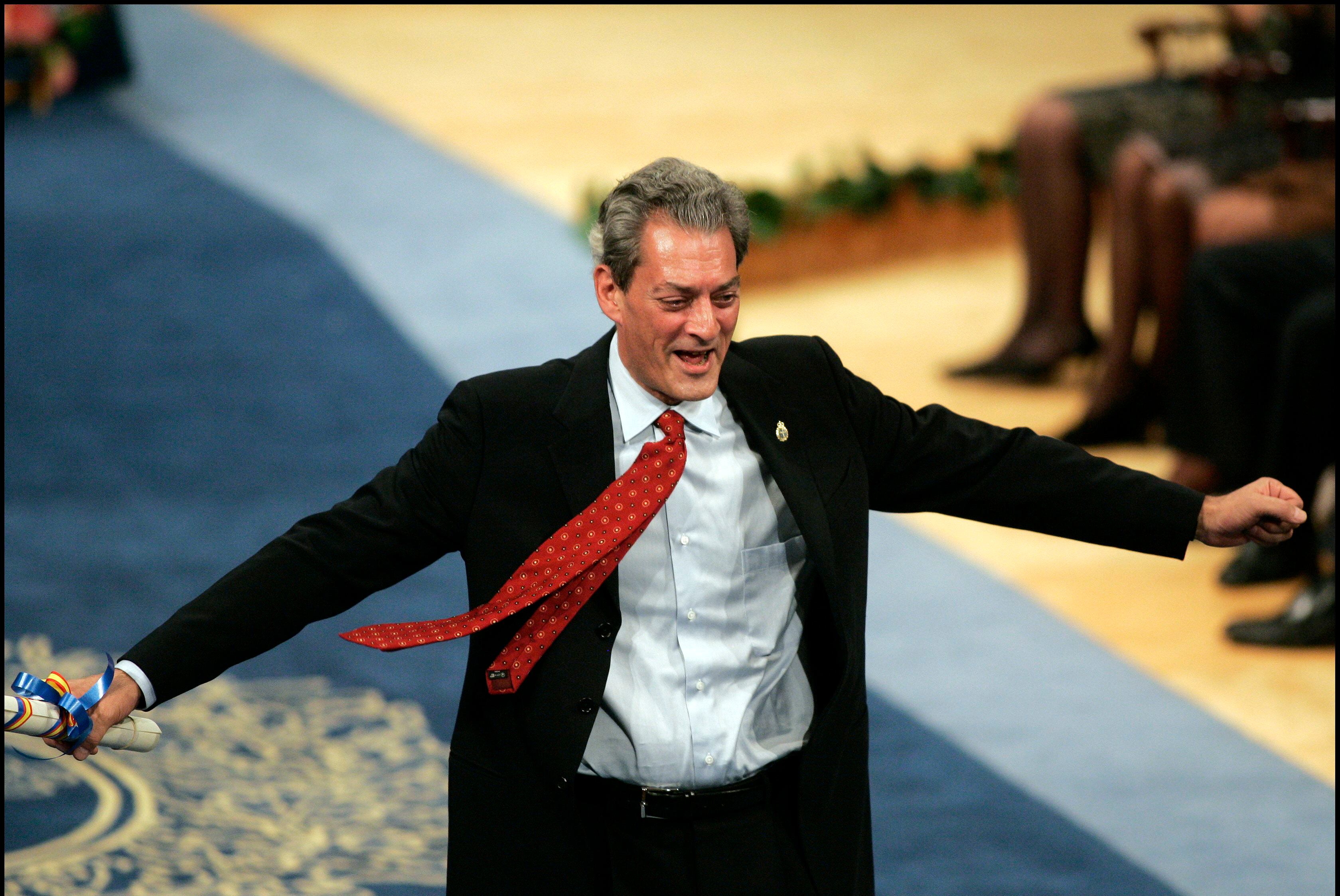 Paul Auster celebrates winning the Letters Award. (Photo by Pool/Corbis via Getty Images)