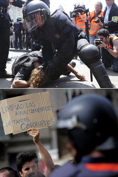 Sobre estas líneas, un <i>mosso d'Esquadra</i> inmoviliza a uno de los concentrados en la plaza de Catalunya de Barcelona durante el desalojo. Abajo, un joven protesta contra la corrupción con una pancarta.
/ josep lago (afp)