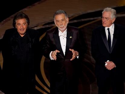 Al Pacino, from left, Francis Ford Coppola and Robert De Niro appear on stage during a "Godfather" reunion at the Oscars on Sunday, March 27, 2022, at the Dolby Theatre in Los Angeles. (AP Photo/Chris Pizzello)